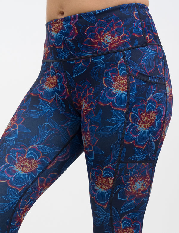 front of the neon flower leggings against a white background against a white background