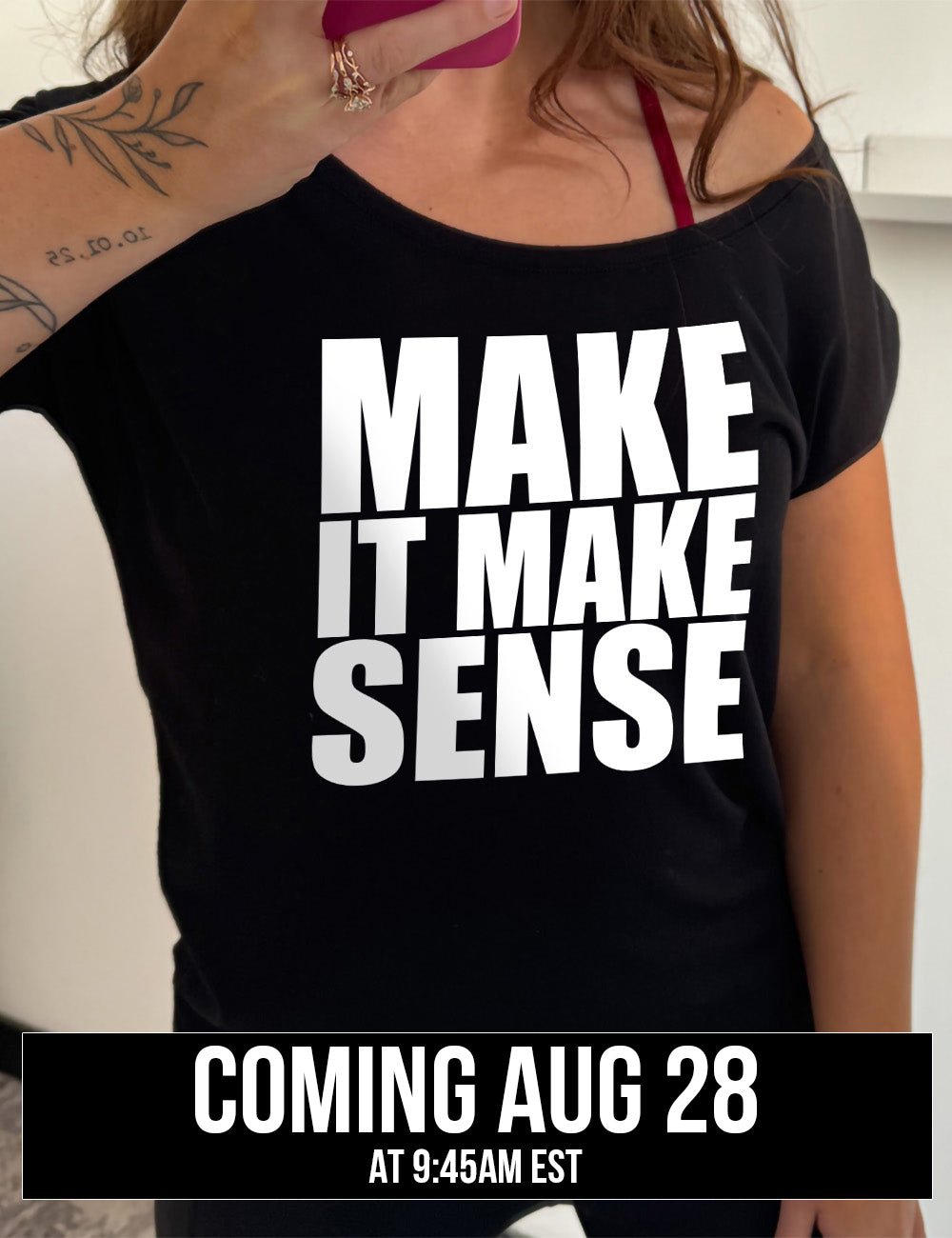 black slouchy tee with the words on it saying "make it make sense", coming august 28th