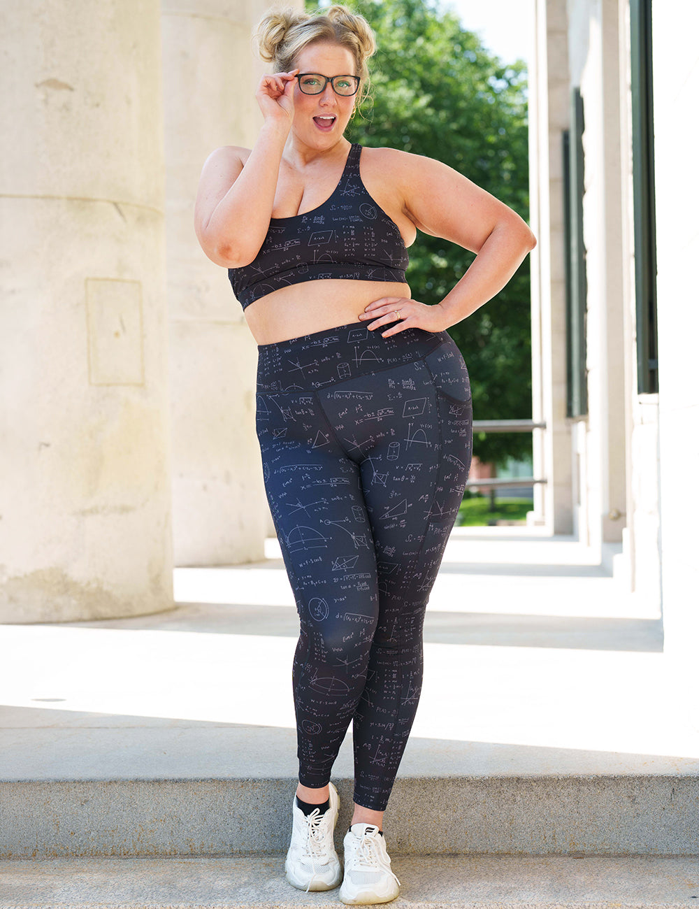 model wearing the Black leggings with mathematical equations and diagrams outside