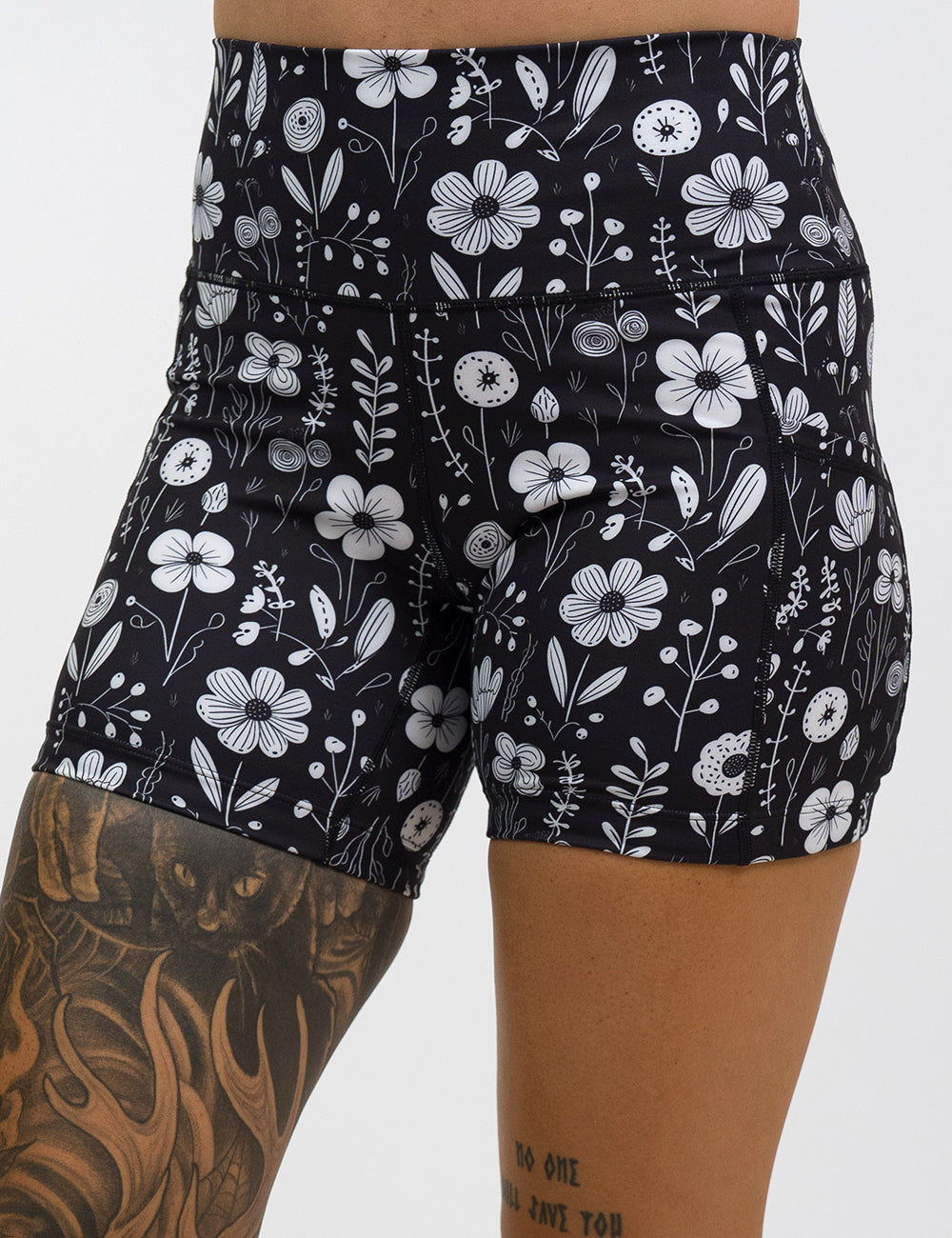 front of the 5 inch black and white floral shorts against a white background