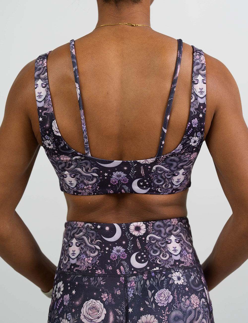 back of the purple medusa with flowers bra against a white background