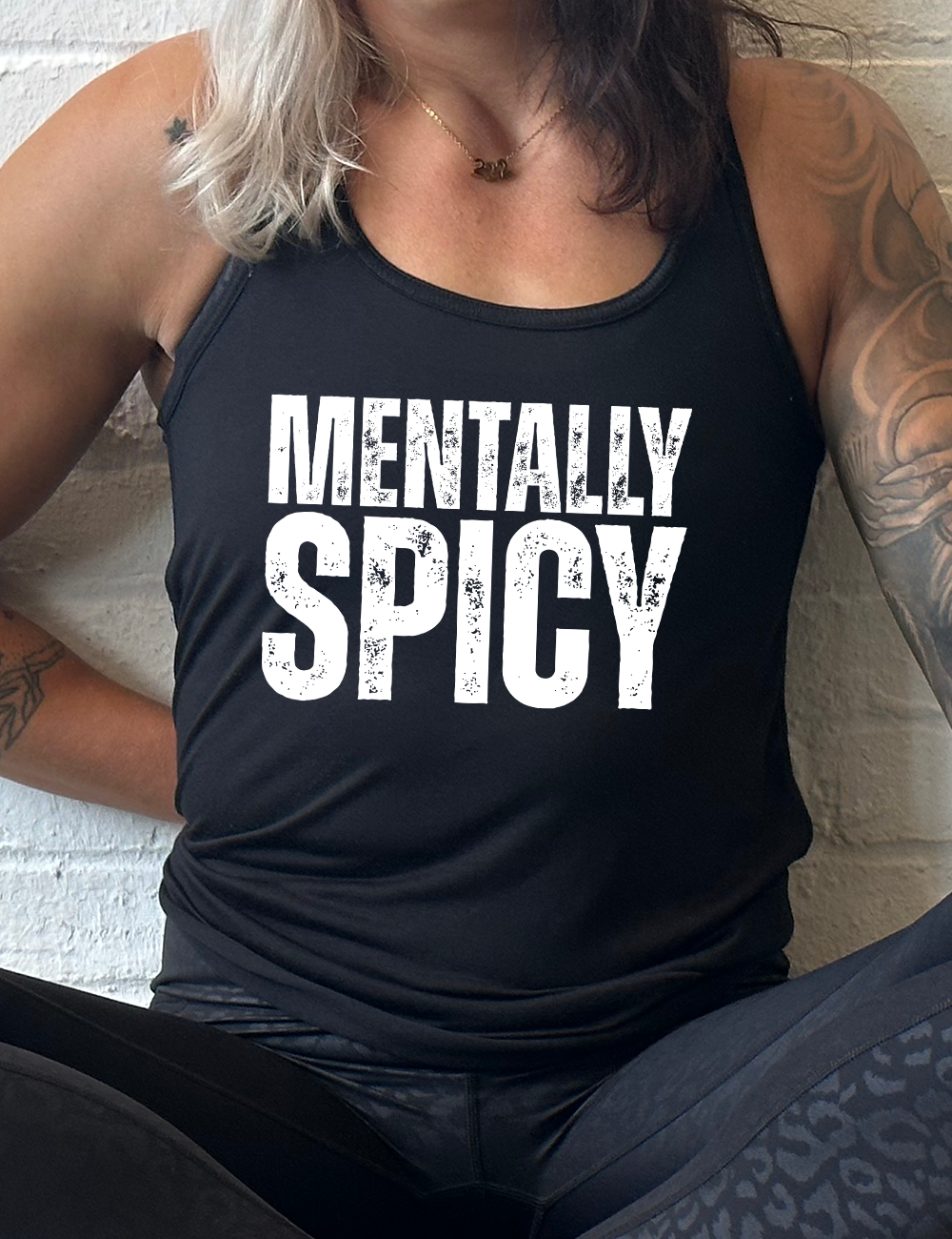 black racerback flowy tank with the words "mentally spice" on it