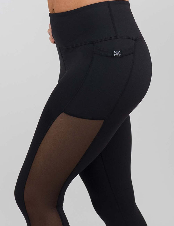 side of the black mesh leggings showing the mesh side lining
