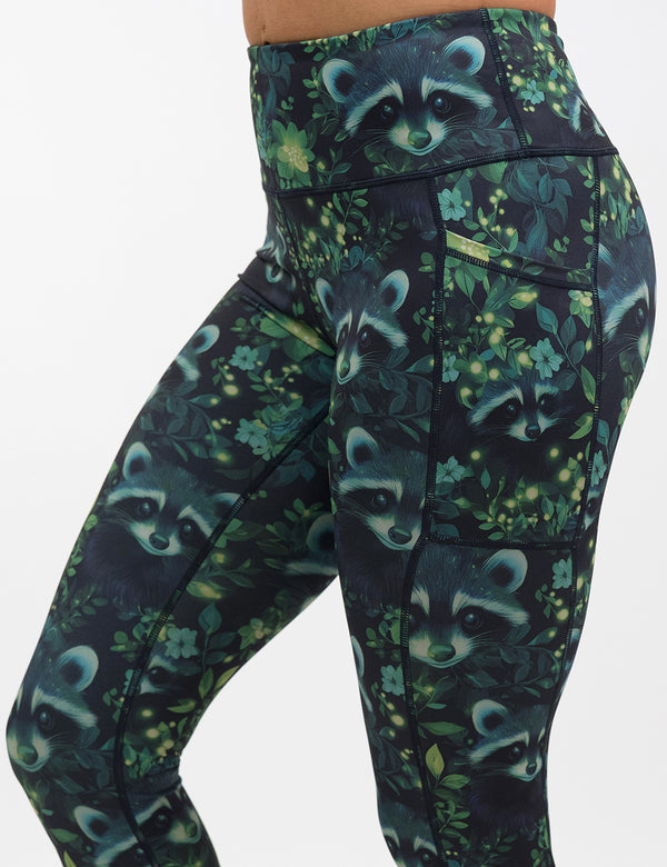green Raccoon design leggings facing the front against a white background