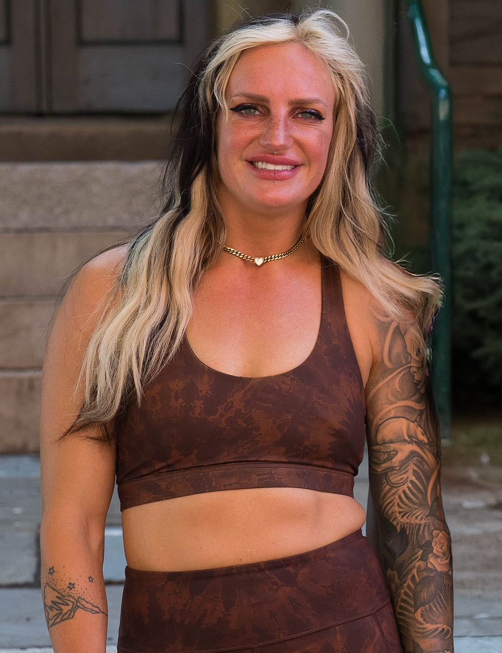 model wearing the brown tie dye sports bra outside