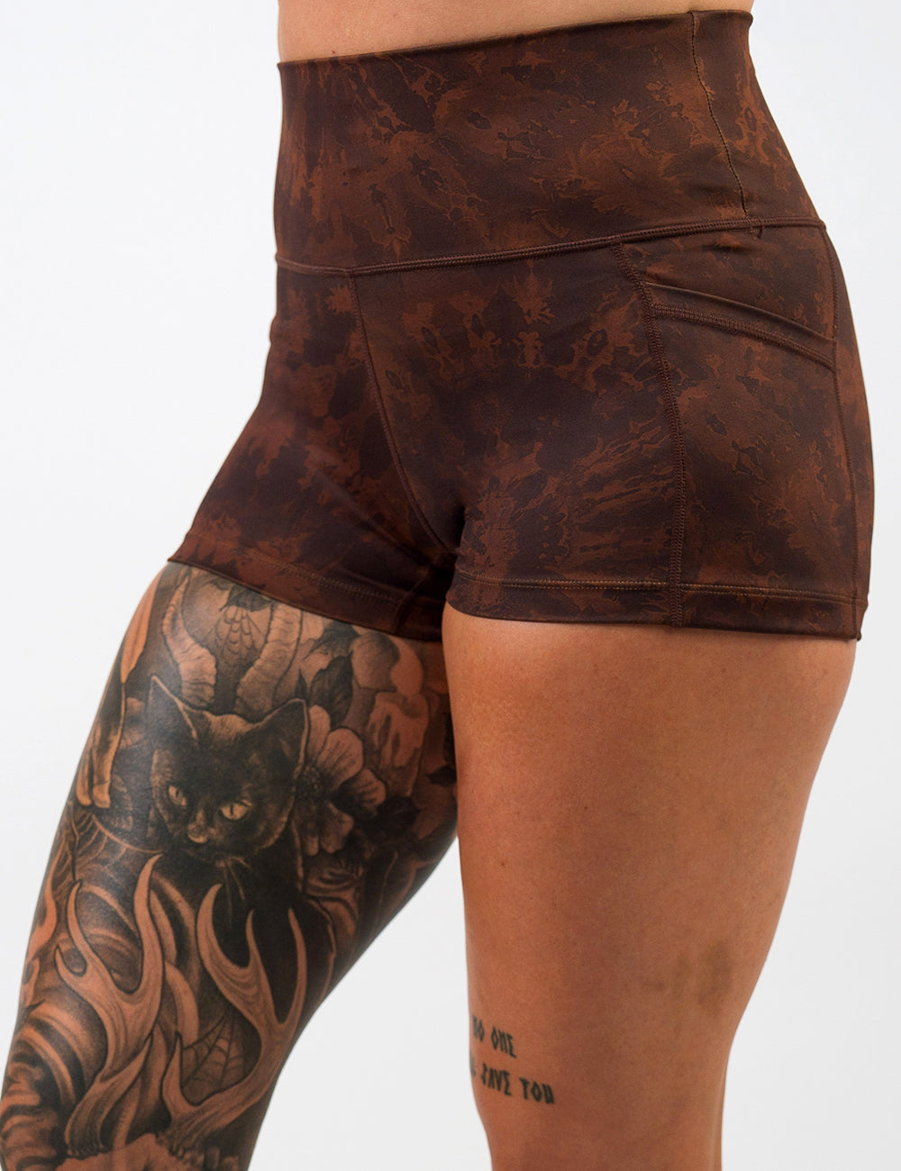 front of the brown tie dye 2.5 inch shorts against a white background