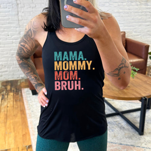model wearing a black racerback tank with the saying "mama. mommy. mom. bruh." on it