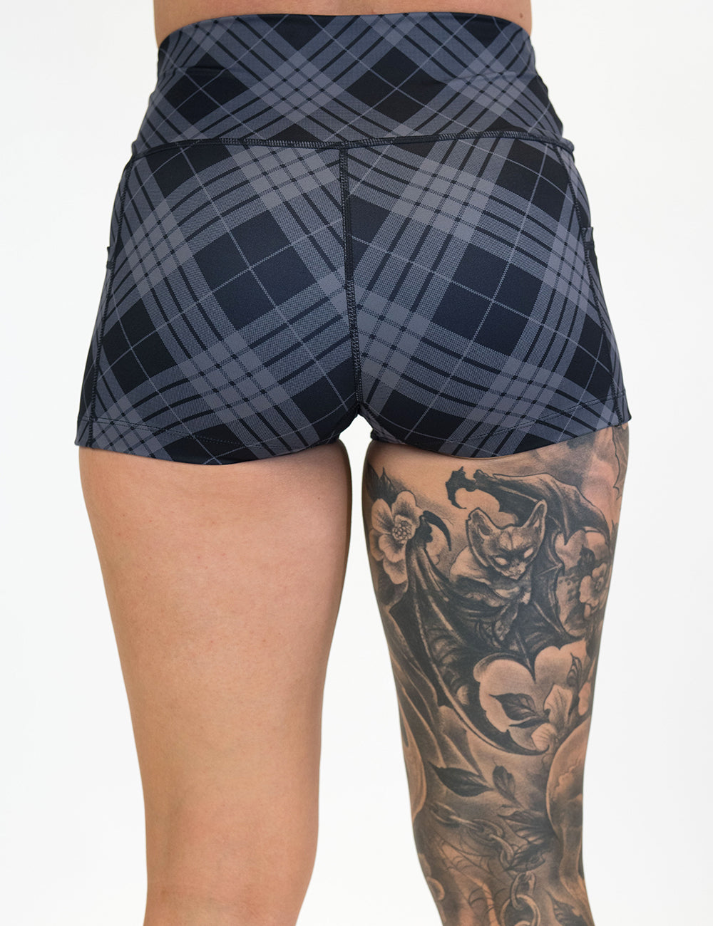 back of the 2.5 inch monochrome colored plaid shorts against a white background