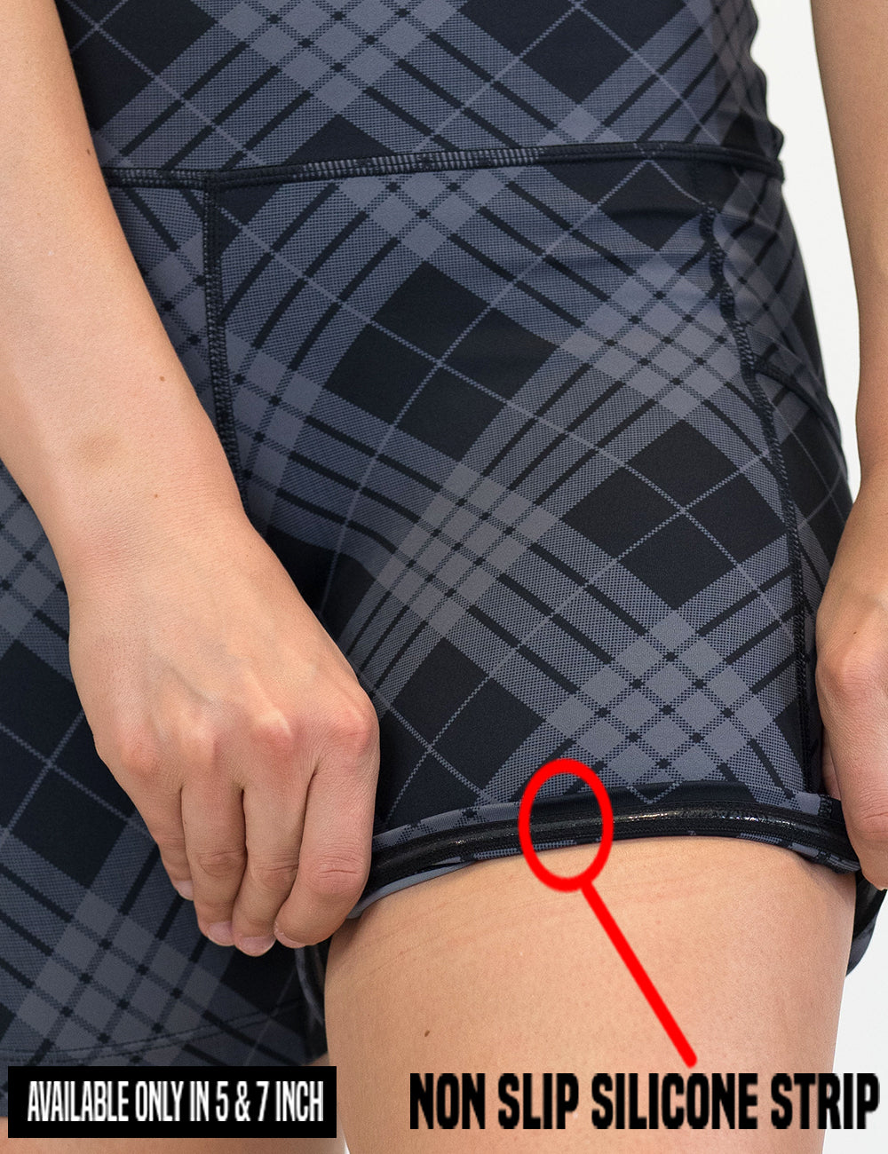 close up of the monochrome colored plaid shorts rolled up to show the non slip silicone strip lining found in the 5 and 7 inch shorts