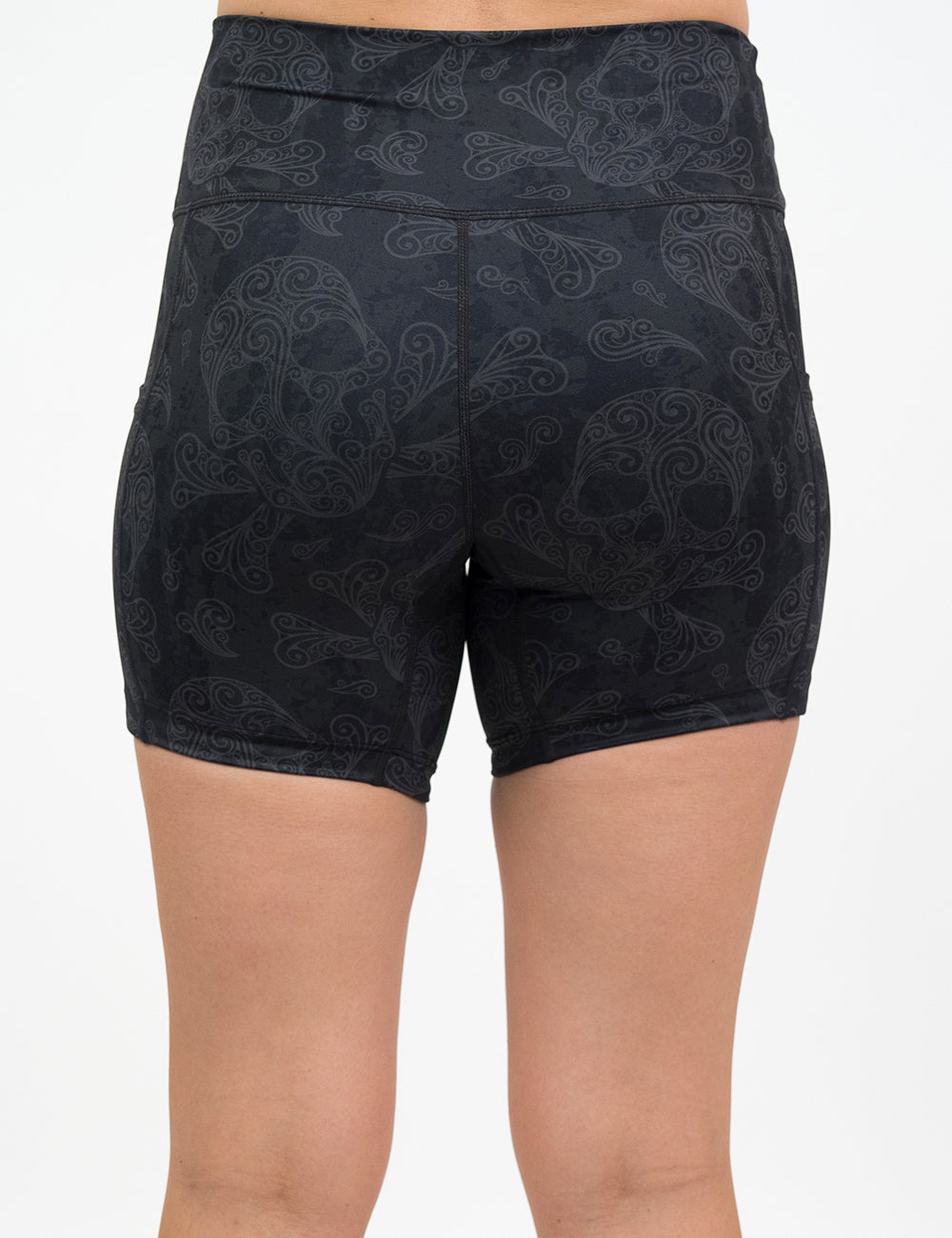 back of the 5 dark skull pattern shorts against a white background