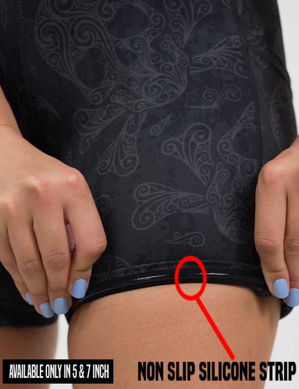 close up of the dark skull pattern shorts rolled up to show the non slip silicone strip found in the 5 and 7 inch sizes