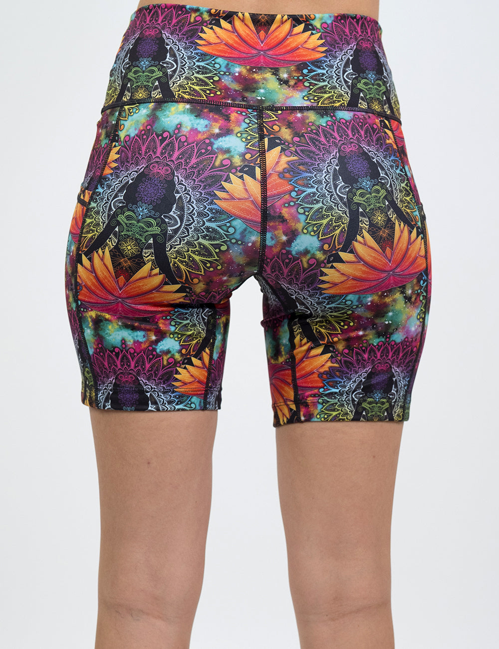 back of the colorful yoga lotus flower shorts against a white background
