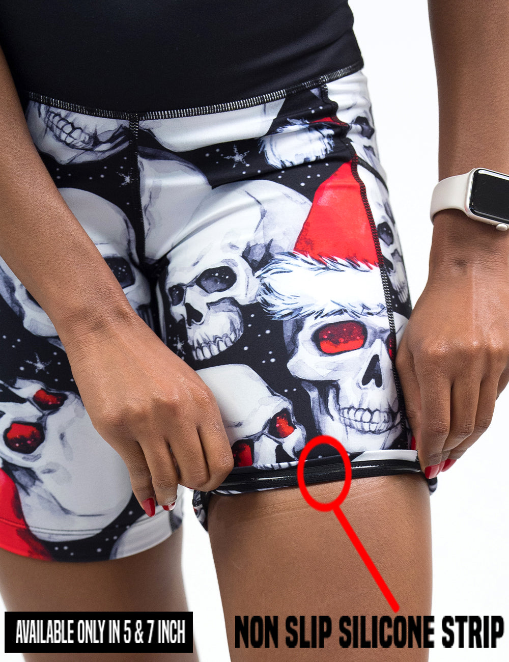 close up of the santa hat and skull pattern shorts being rolled up to show the non slip silicone strip found in the 5 and 7 inch inseam shorts