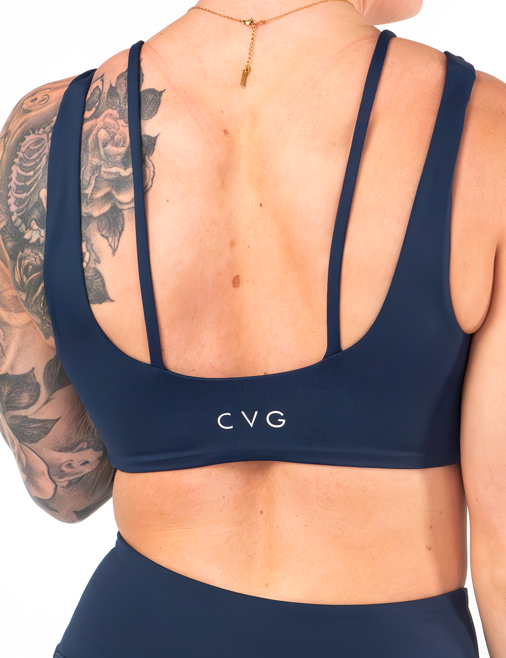 back of the solid navy blue vista bra against a white background