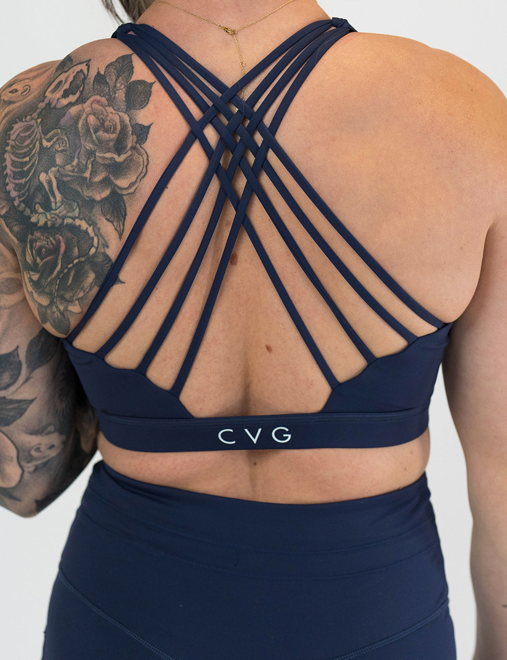 back of the navy blue sports bra
