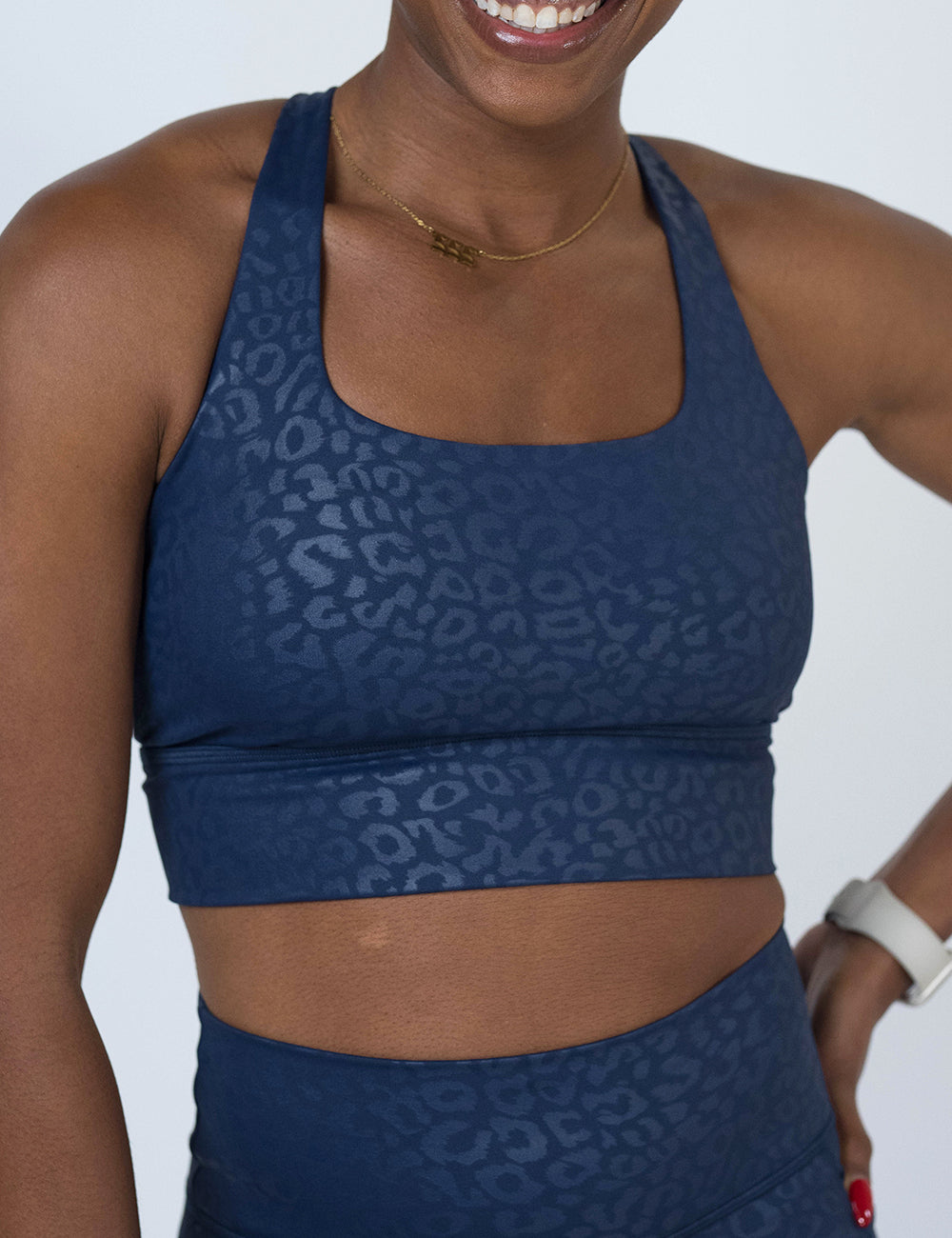 front of the Blue leopard print patterned sports bra against a white background
