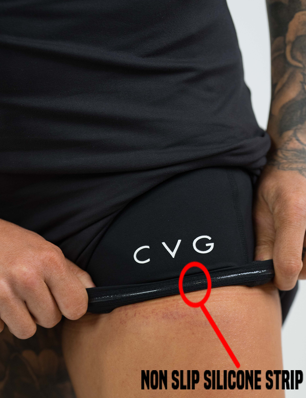 close up of the shorts under the black dress rolled up to show the non slip silicone strip underneath