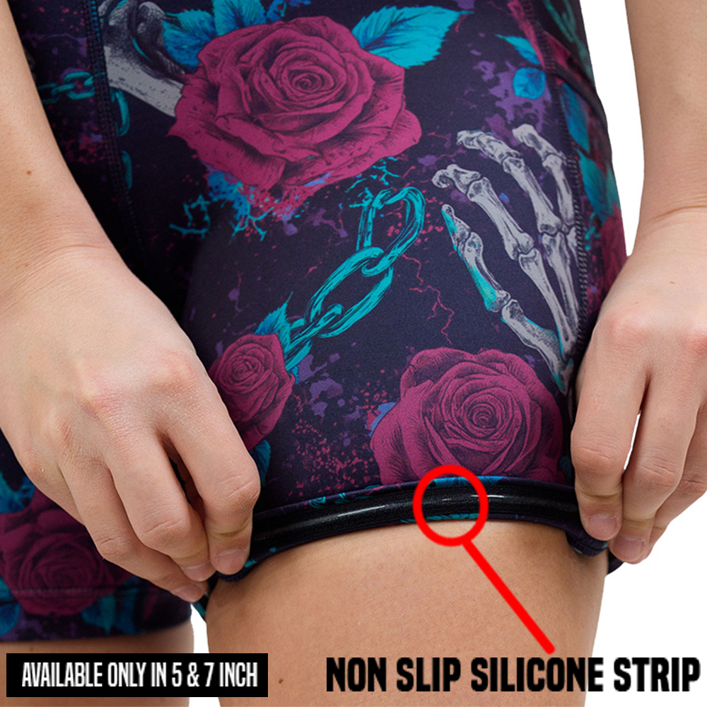 roses and skeleton hands connected by chain links pattern shorts rolled up to show the non slip silicone strip only available in the 5 and 7 inch shorts