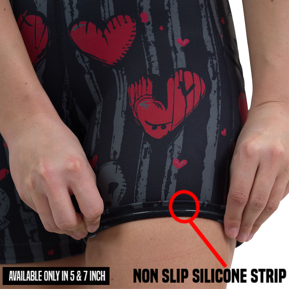 rolled up red heart and gray skulls against a black and grey striped background shorts to showcase the non slip silicon strip that is only available in the 5 and 7 inch shorts