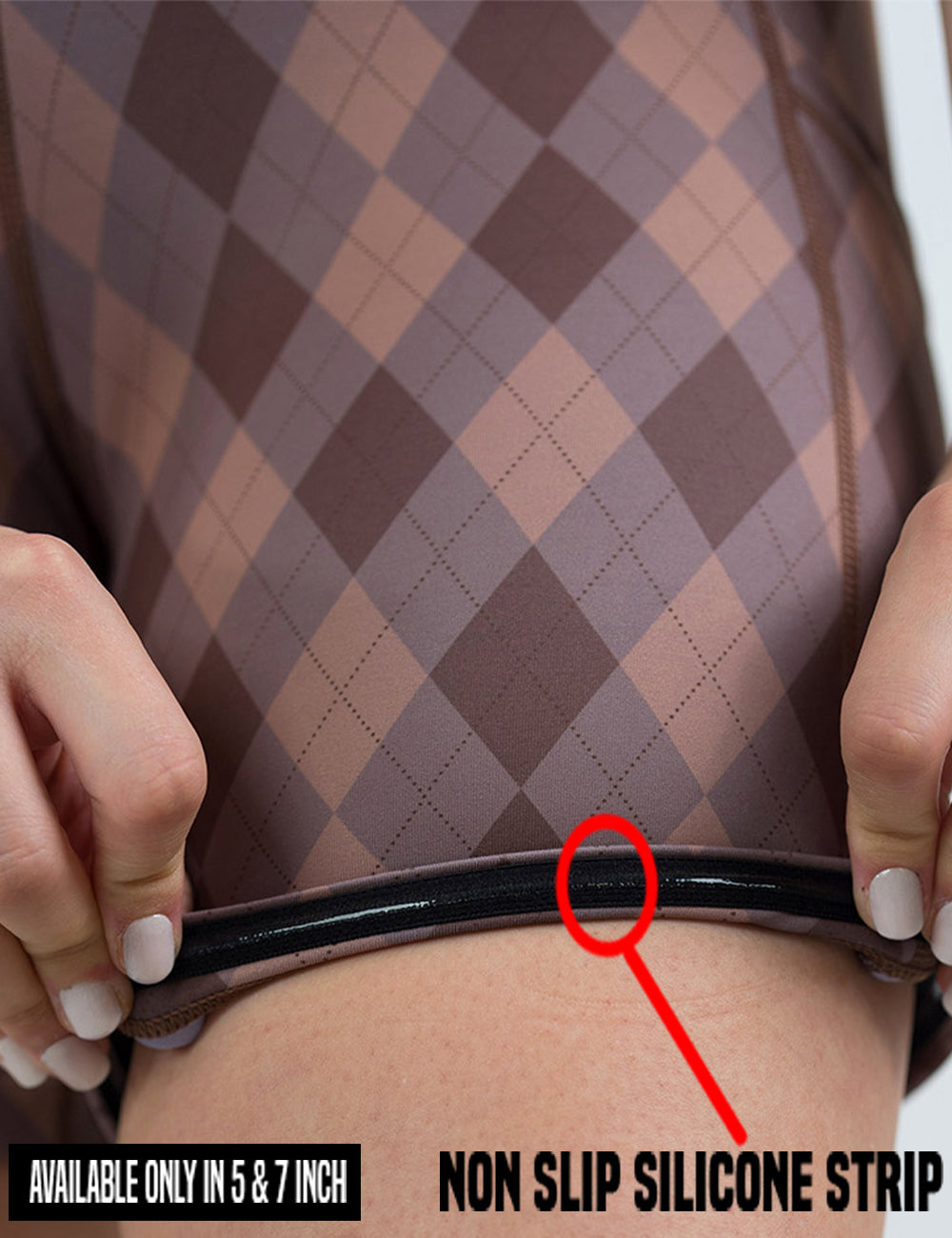 close up of the beige, grey, and brown plaid shorts being rolled up to show the none slip silicone strip found in the 5 and 7 inch inseam length