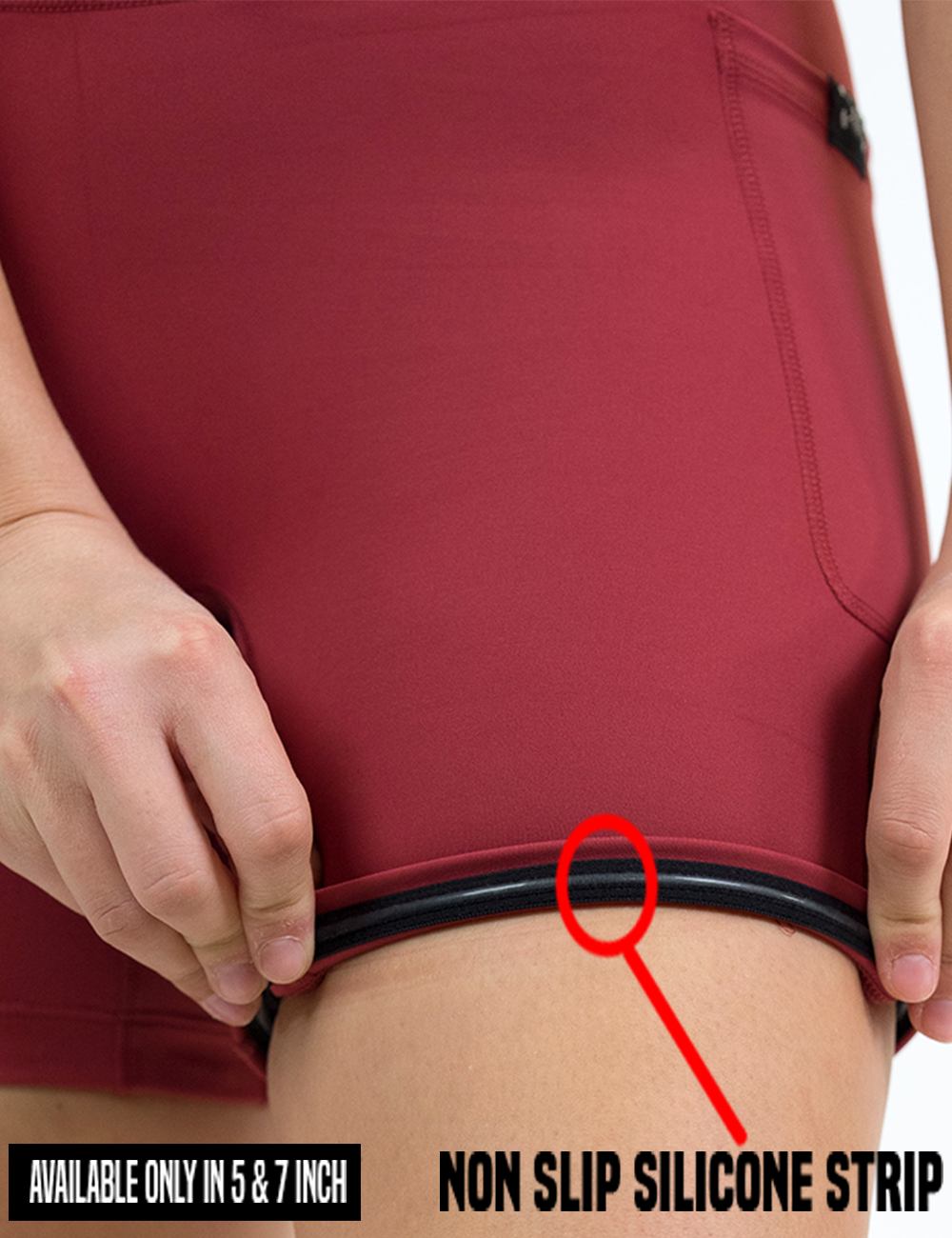 close up of the omni solid red shorts pulled up to show the non slip silicone strip found only in the 5 and 7 inch shorts