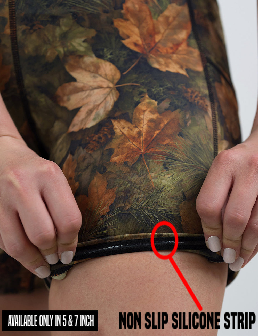 close up of the forest floor covered in leaves shorts being rolled up to show the non slip silicone strip found in the 5 and 7 inch shorts