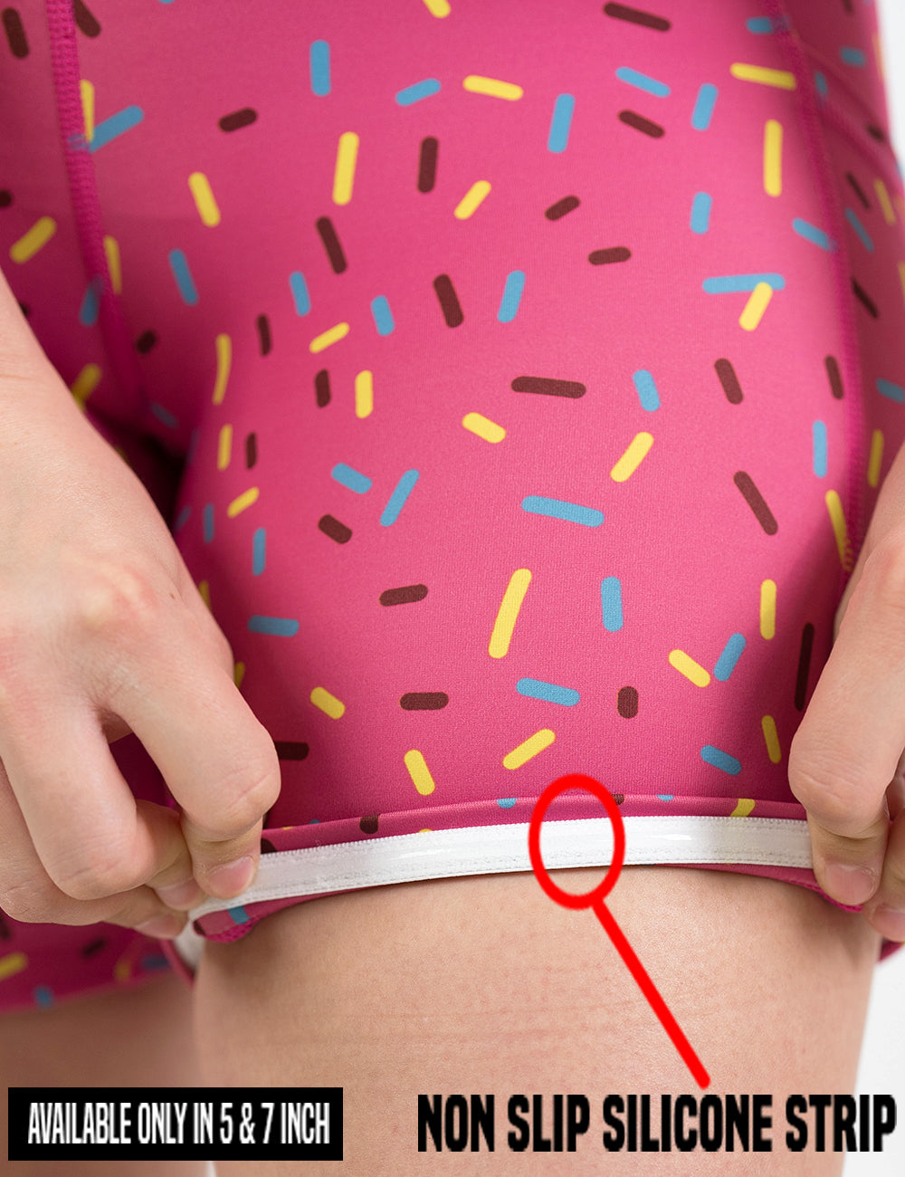 close up of the pink shorts with a sprinkles pattern being rolled up to show the non slip silicone strip found on the 5 and 7 inch sizes