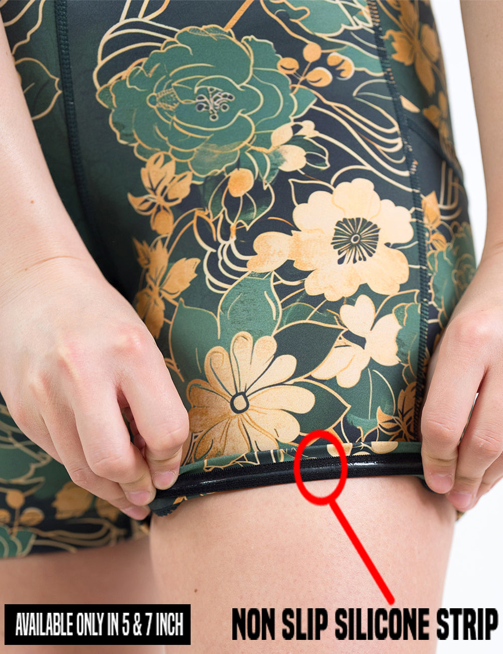 close up of the green and gold flower with gold accent shorts being rolled up to show the non slip silicone strip found in the 5 and 7 inch shorts