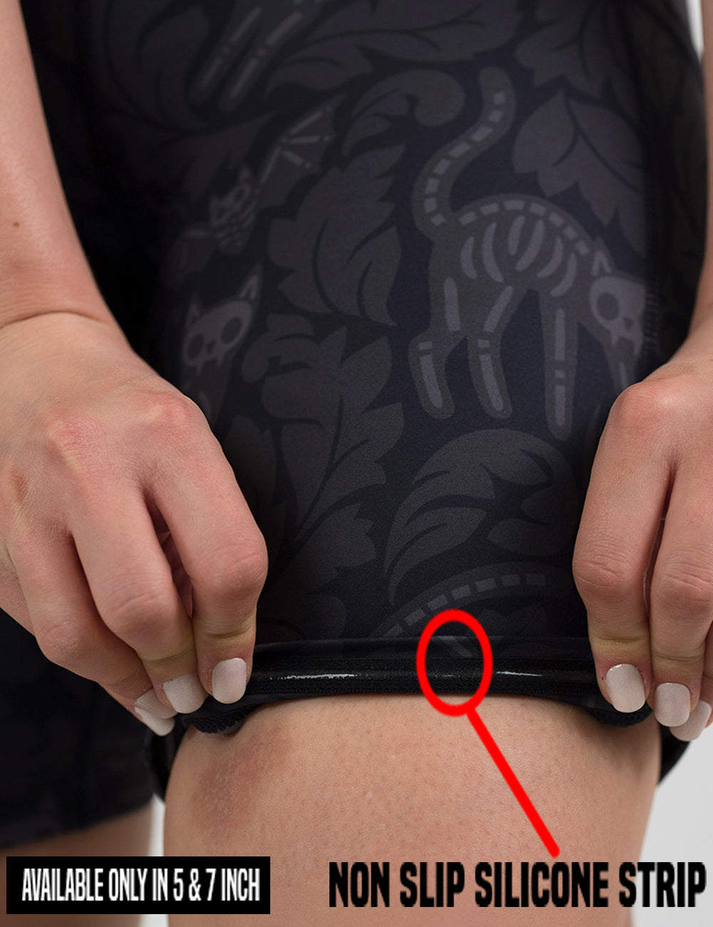 close up of the black and grey bats and cats skeleton being rolled up to show the non slip silicone strip found in the 5 and 7 inch shorts