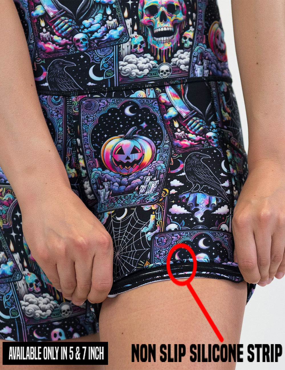close up of the rainbow skulls, jack o lantern, and ghosts shorts being rolled up to show the non slip silicone strip found in the 5 and 7 inch shorts