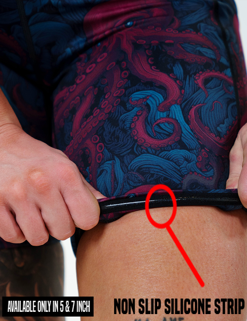 close up of the blue octopus with blue eyes shorts rolled up to show the non slip silicone strip lining found in the 5 and 7 inch inseam lengths