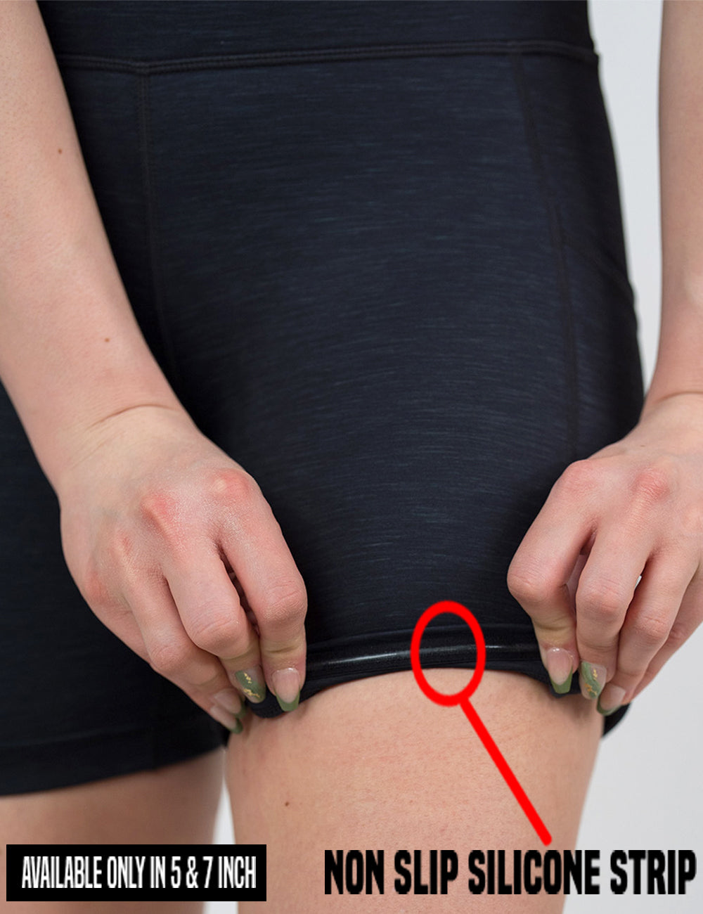 close up of the black heather pattern shorts being rolled up to show the non slip silicone strip found in the 5 and 7 inch inseam lengths