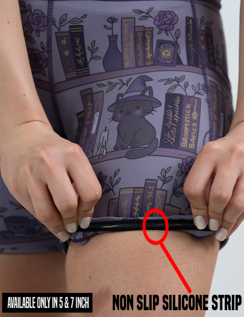 close up of the ghosts and cats book shelves shorts being rolled up to show the non slip silicone strip found in the 5 and 7 inch shorts