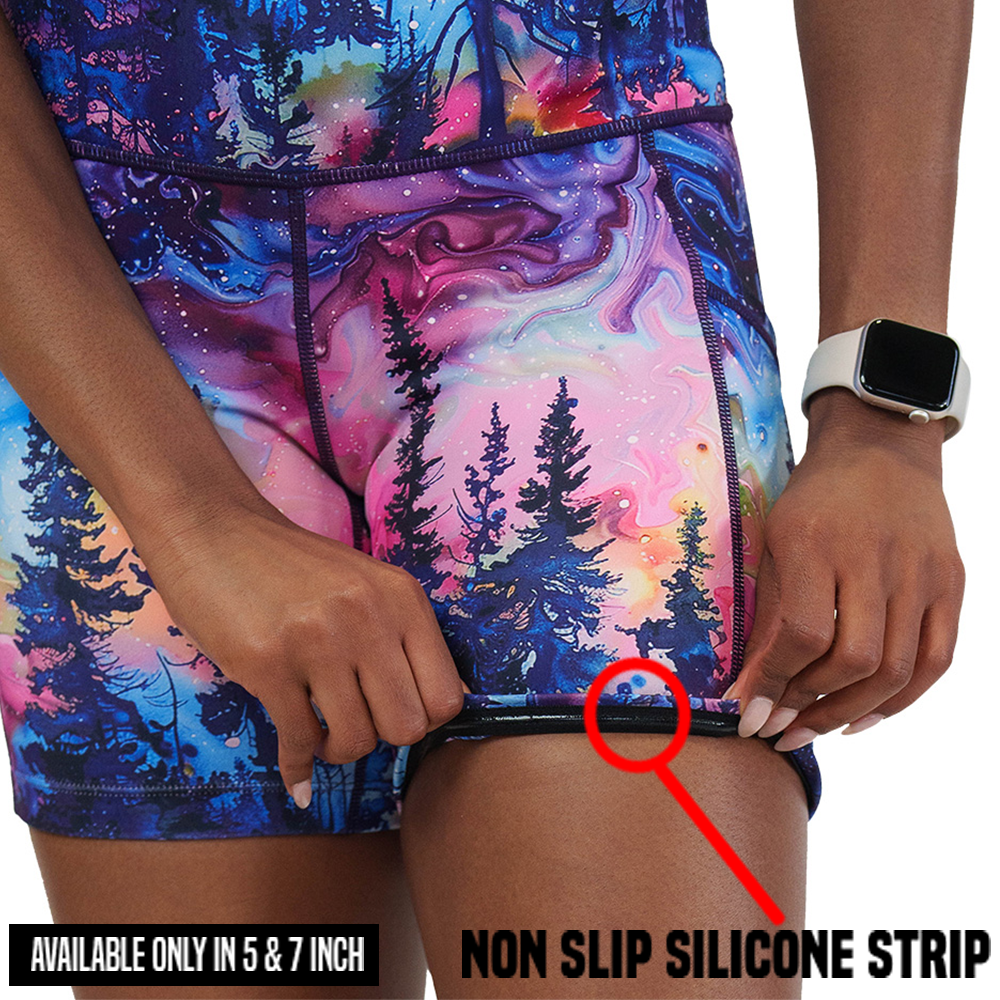 watercolor rainbow patterned forest shorts rolled up to show the non slip silicone strip found in the 5 and 7 inch shorts