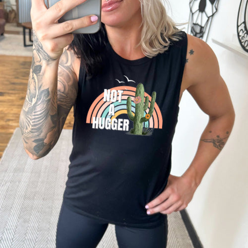 model wearing the black not a hugger muscle tank top