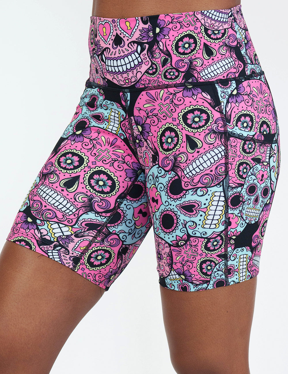 front of the 7 inch pink, blue & purple skull print shorts against a white background