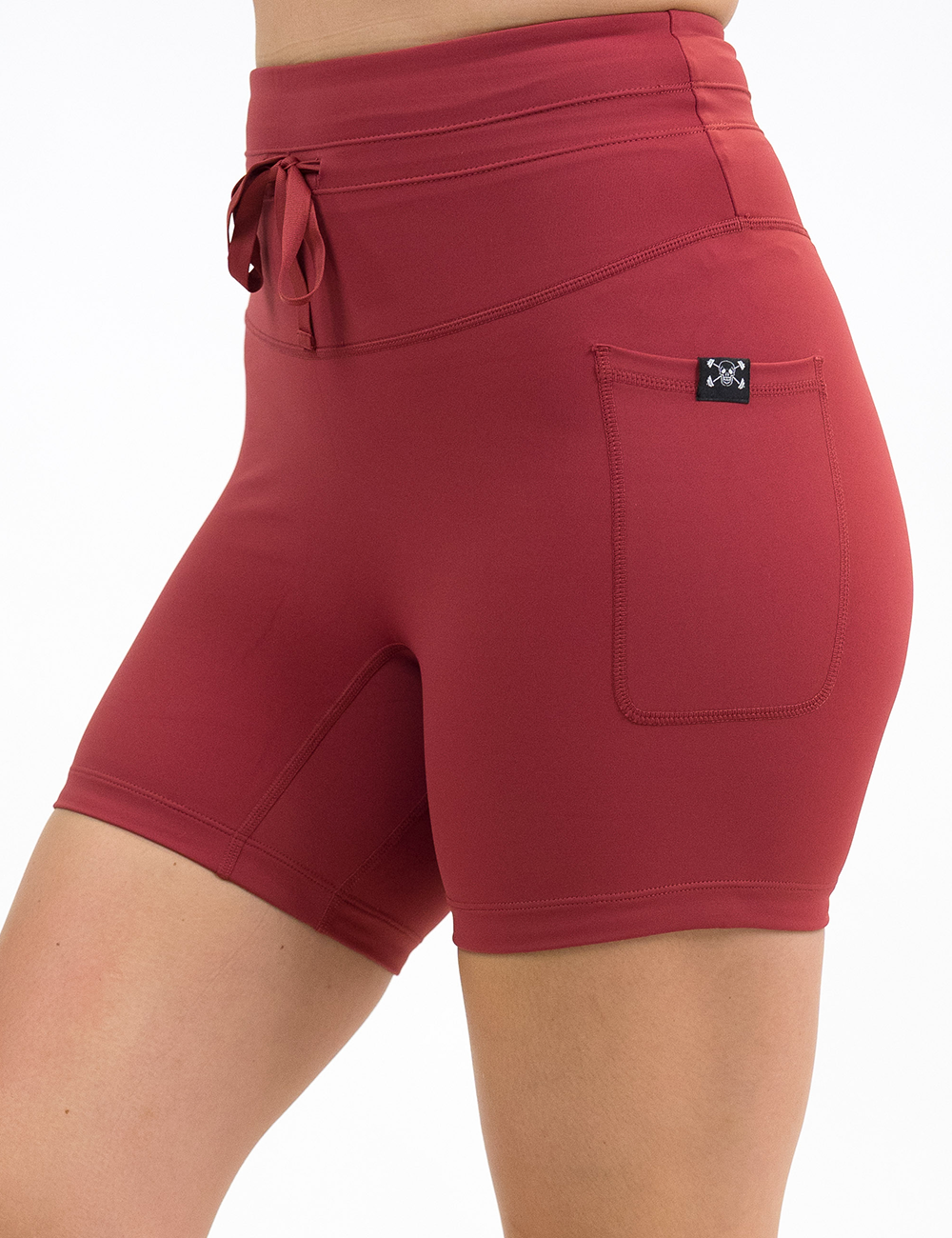 front of the omni solid red 5 inch shorts against a white background
