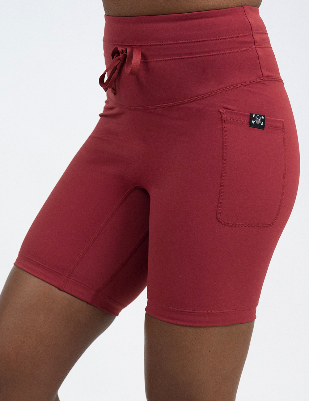 front of the 7 inch solid red omni shorts against a white background