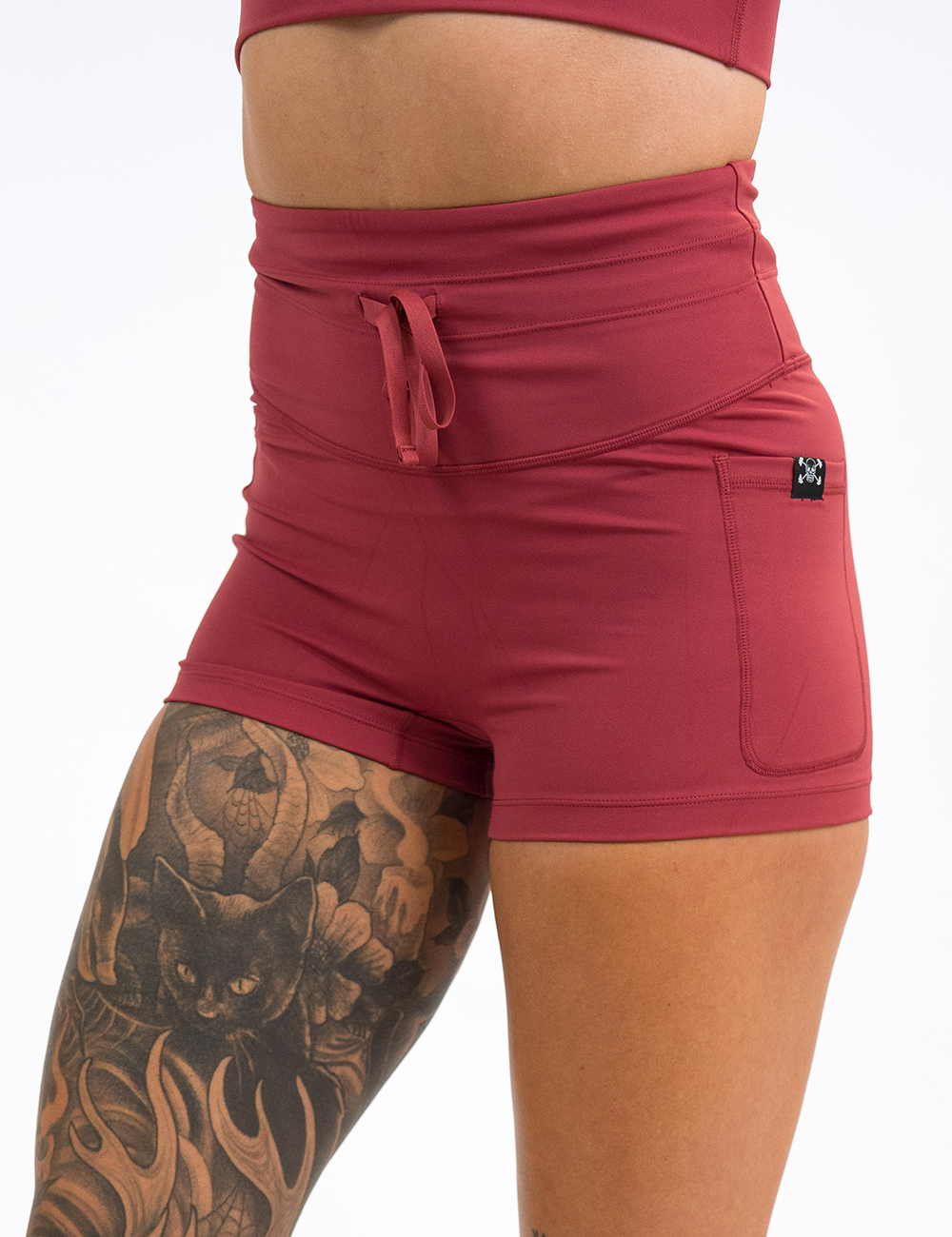 front of the 2.5 inch omni solid red shorts against a white background