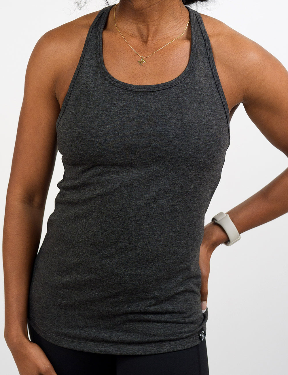 front of the open back grey tank top against a white background