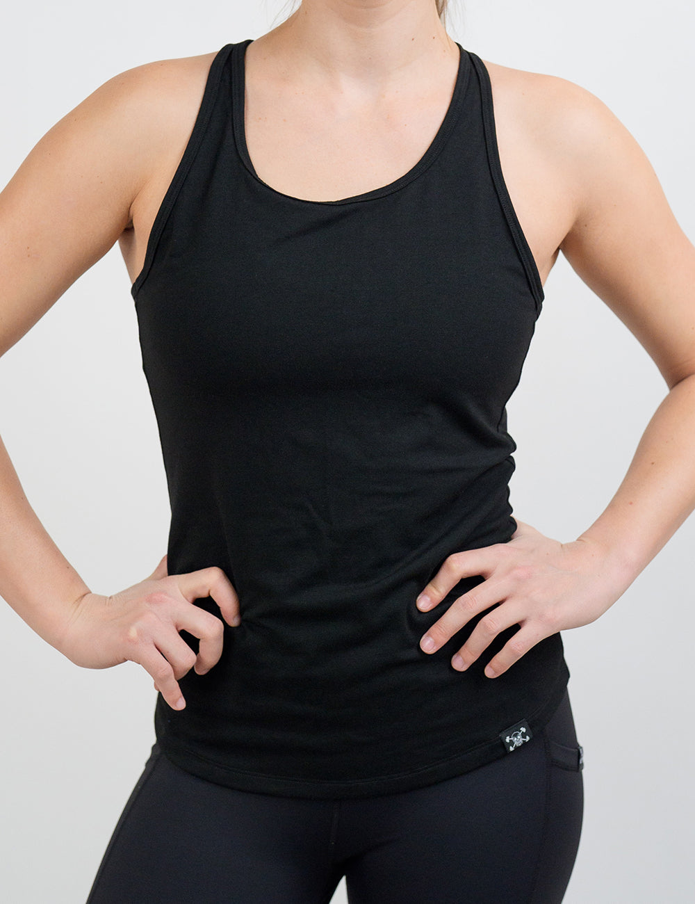 front of the black open tank top