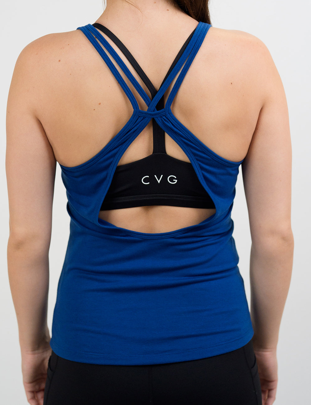 back of the open back dark blue tank top against a white background