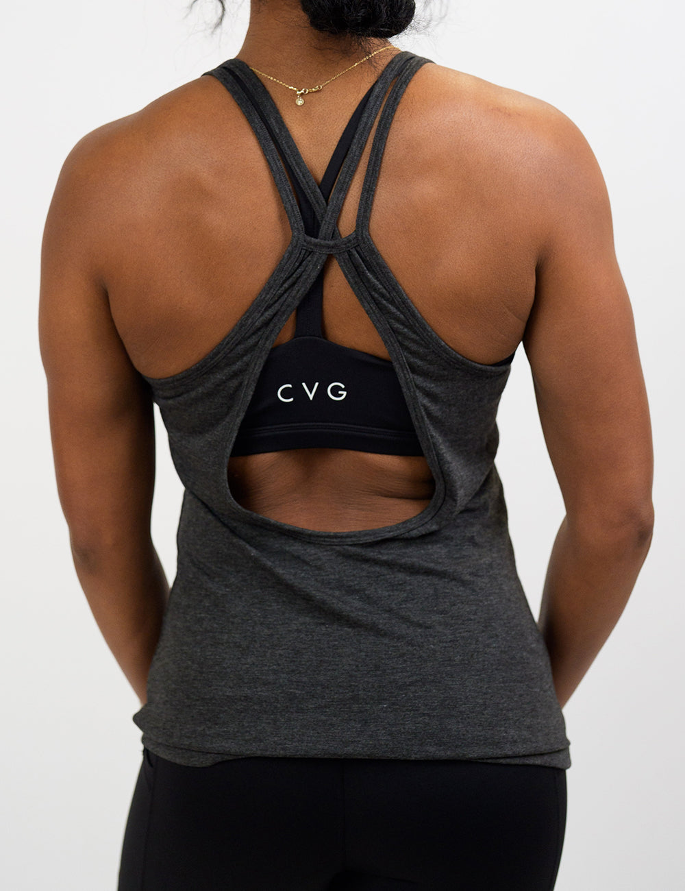 back of the open back grey tank top against white background
