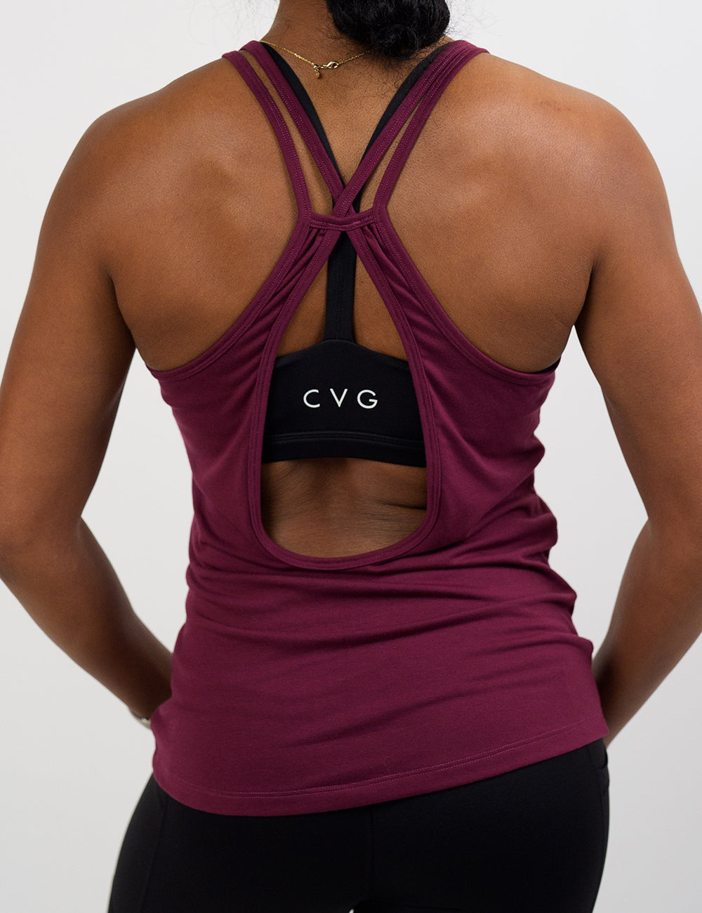 back of the dark red tank top with open back against a white background