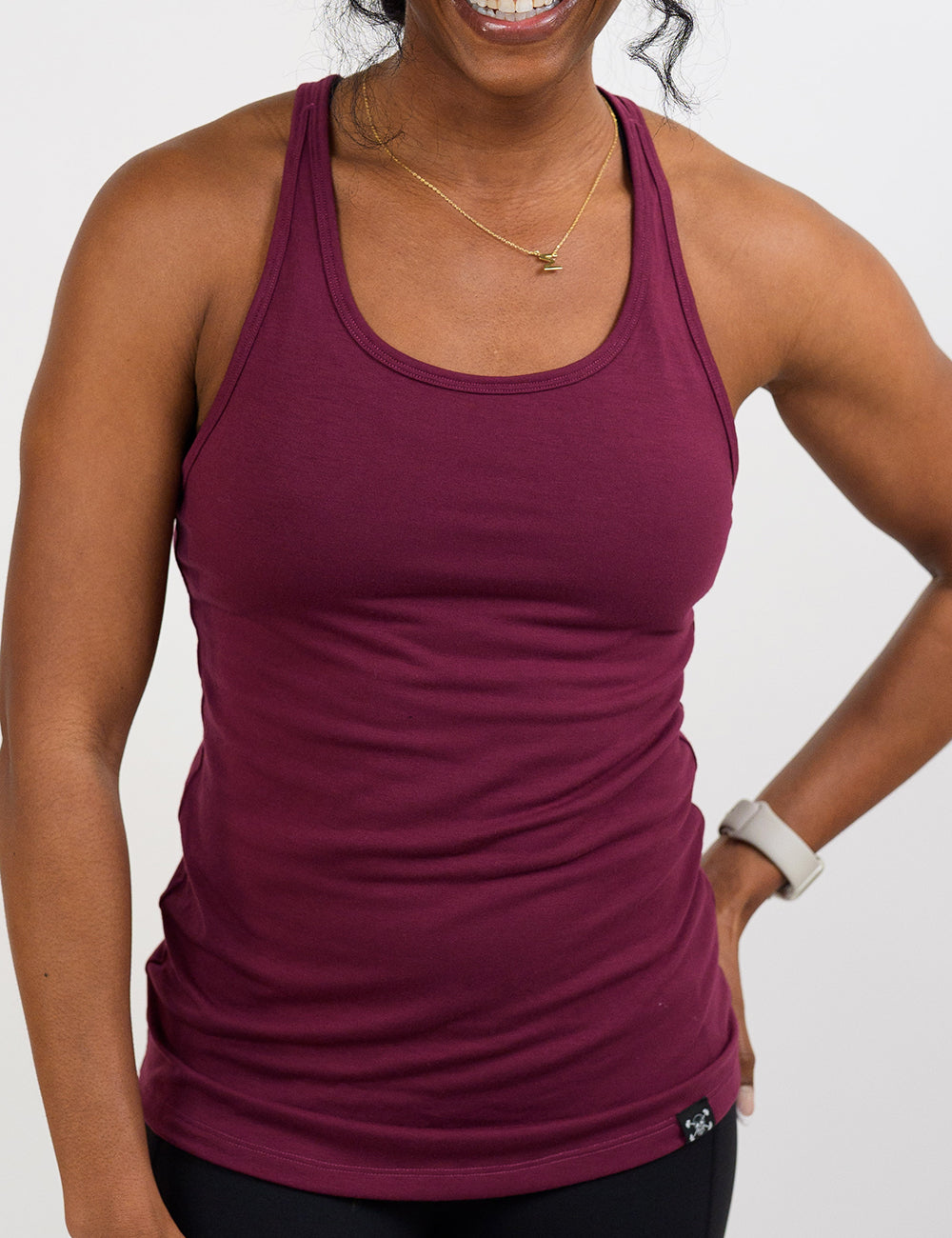 front of the dark red tank top with open back against a white background