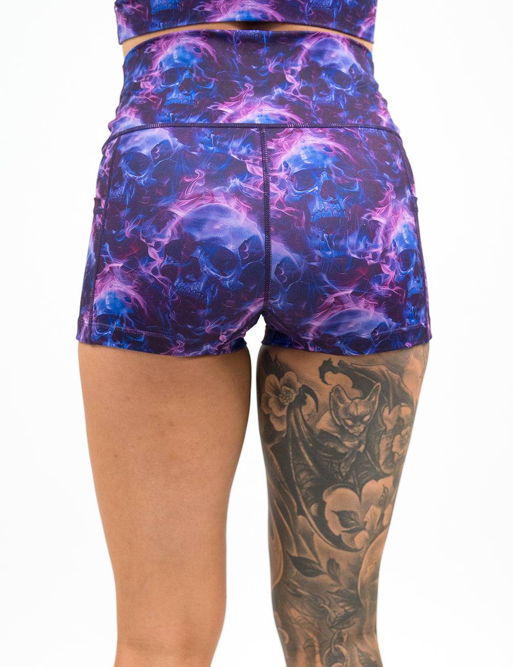 back of the 2.5 inch dark purple skulls on fire shorts against a white background