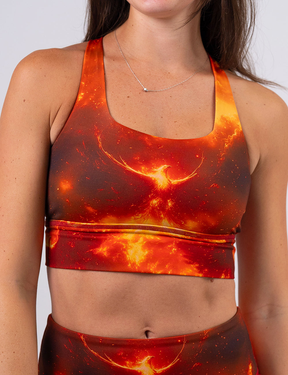 front of the phoenix surrounded by fire sports bra