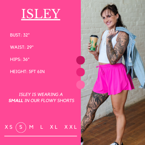 Model's measurements of 32 inch bust, 29 inch waist, 36 inch hips, and height of 5 foot 6 inches. She is wearing a size small in the flowy shorts