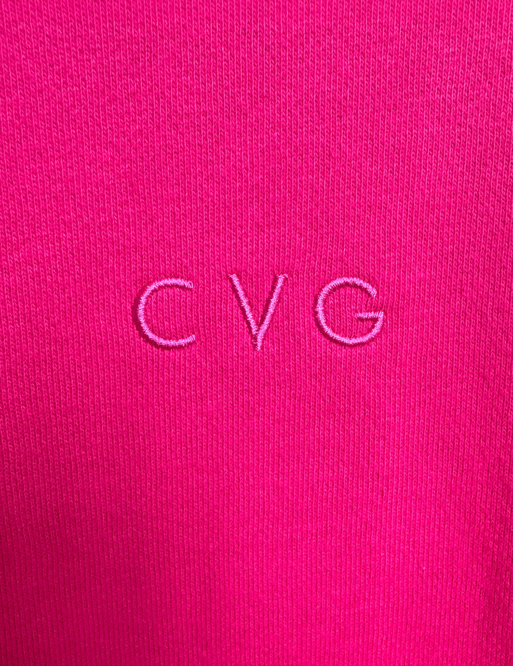 close up of the subtle CVG logo found on the pink unwind hoodies and sweatpants