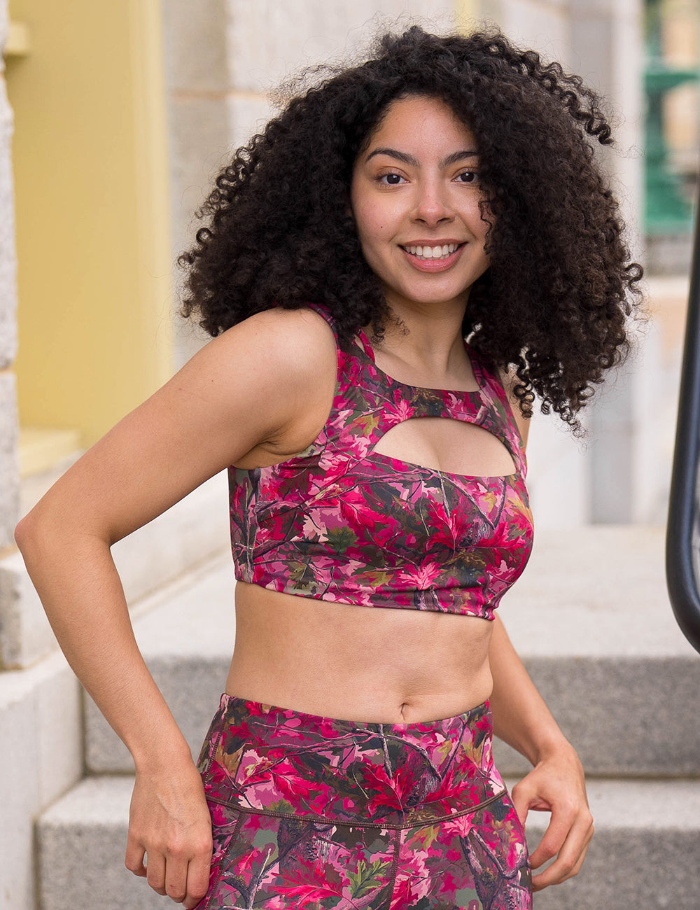 model wearing the pink forest camo vista bra